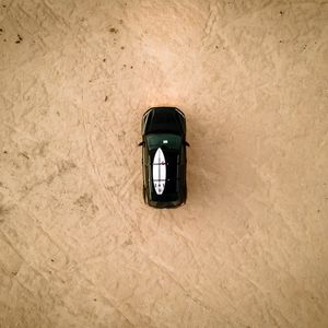 Preview wallpaper car, beach, aerial view, surfboard, black