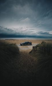 Preview wallpaper car, beach, sand, storm, coast