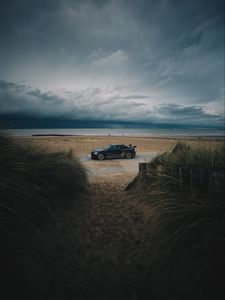 Preview wallpaper car, beach, sand, storm, coast