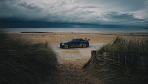 Preview wallpaper car, beach, sand, storm, coast