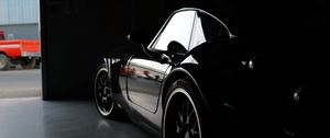 Preview wallpaper car, black, garage, darkness