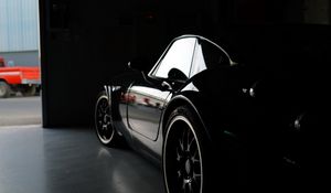 Preview wallpaper car, black, garage, darkness