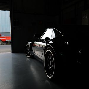 Preview wallpaper car, black, garage, darkness
