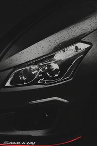 Preview wallpaper car, black, headlight, drops, wet