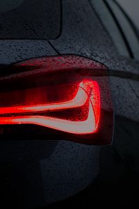 Preview wallpaper car, black, wet, taillight, backlight