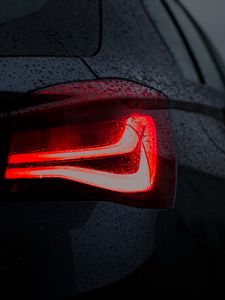 Preview wallpaper car, black, wet, taillight, backlight