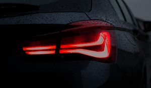 Preview wallpaper car, black, wet, taillight, backlight