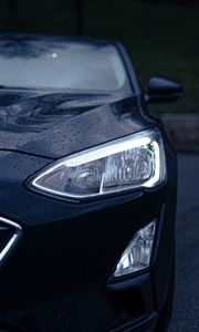 Preview wallpaper car, black, wet, headlights, front view