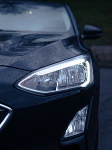 Preview wallpaper car, black, wet, headlights, front view