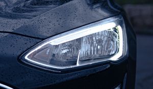 Preview wallpaper car, black, wet, headlights, front view