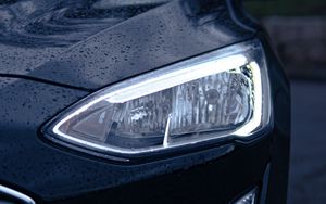 Preview wallpaper car, black, wet, headlights, front view