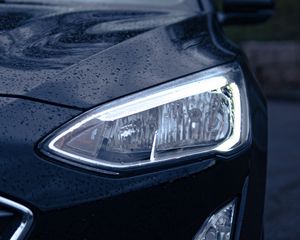 Preview wallpaper car, black, wet, headlights, front view