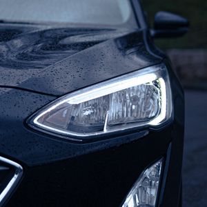 Preview wallpaper car, black, wet, headlights, front view