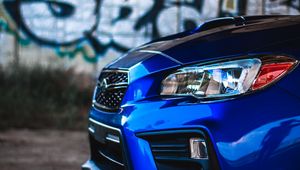 Preview wallpaper car, blue, headlight, graffiti