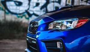 Preview wallpaper car, blue, headlight, graffiti