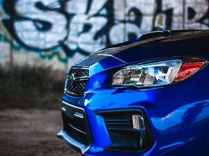 Preview wallpaper car, blue, headlight, graffiti