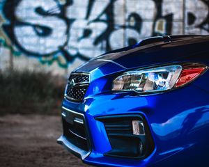 Preview wallpaper car, blue, headlight, graffiti