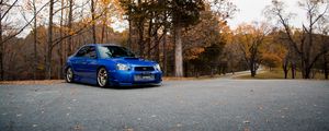 Preview wallpaper car, blue, parking, trees