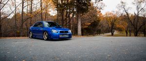 Preview wallpaper car, blue, parking, trees
