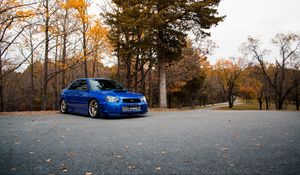 Preview wallpaper car, blue, parking, trees