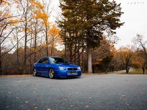 Preview wallpaper car, blue, parking, trees