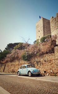 Preview wallpaper car, blue, retro, tower, architecture