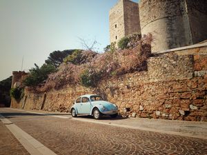 Preview wallpaper car, blue, retro, tower, architecture