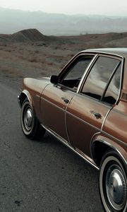 Preview wallpaper car, brown, retro, road, mountains