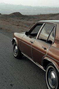 Preview wallpaper car, brown, retro, road, mountains