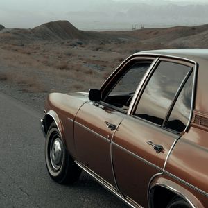 Preview wallpaper car, brown, retro, road, mountains