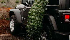 Preview wallpaper car, christmas tree, tree, suv, black