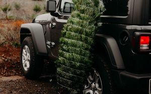 Preview wallpaper car, christmas tree, tree, suv, black