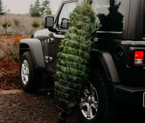 Preview wallpaper car, christmas tree, tree, suv, black