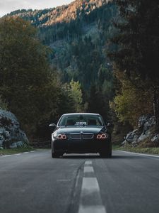 Preview wallpaper car, front view, road, trees, forest