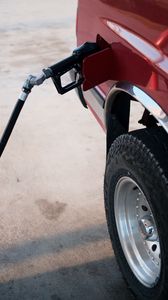 Preview wallpaper car, gas station, wheel, red