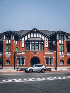 Preview wallpaper car, gray, building, road, asphalt