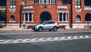 Preview wallpaper car, gray, building, road, asphalt