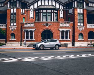 Preview wallpaper car, gray, building, road, asphalt