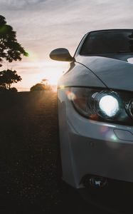 Preview wallpaper car, gray, headlight, sunlight, glare