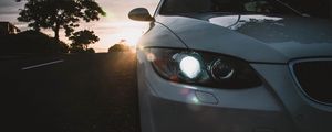 Preview wallpaper car, gray, headlight, sunlight, glare