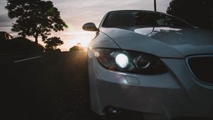 Preview wallpaper car, gray, headlight, sunlight, glare