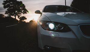 Preview wallpaper car, gray, headlight, sunlight, glare