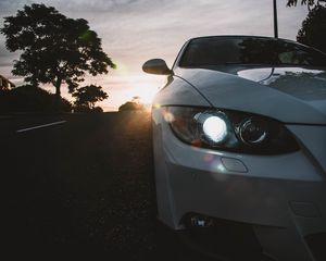 Preview wallpaper car, gray, headlight, sunlight, glare