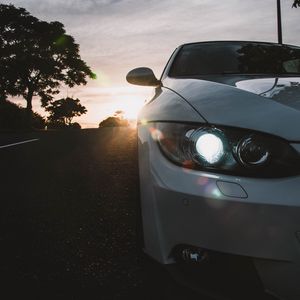 Preview wallpaper car, gray, headlight, sunlight, glare