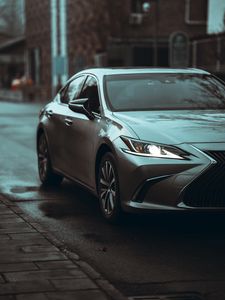 Preview wallpaper car, gray, headlight, road, front view