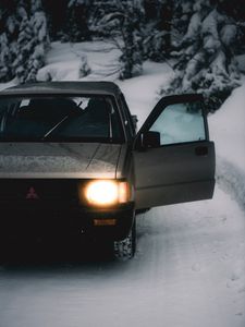 Preview wallpaper car, gray, road, snow, winter