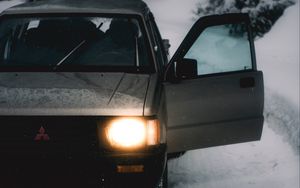 Preview wallpaper car, gray, road, snow, winter