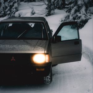 Preview wallpaper car, gray, road, snow, winter