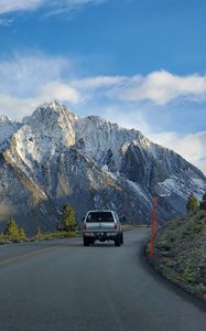 Preview wallpaper car, gray, road, mountains
