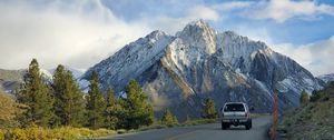 Preview wallpaper car, gray, road, mountains
